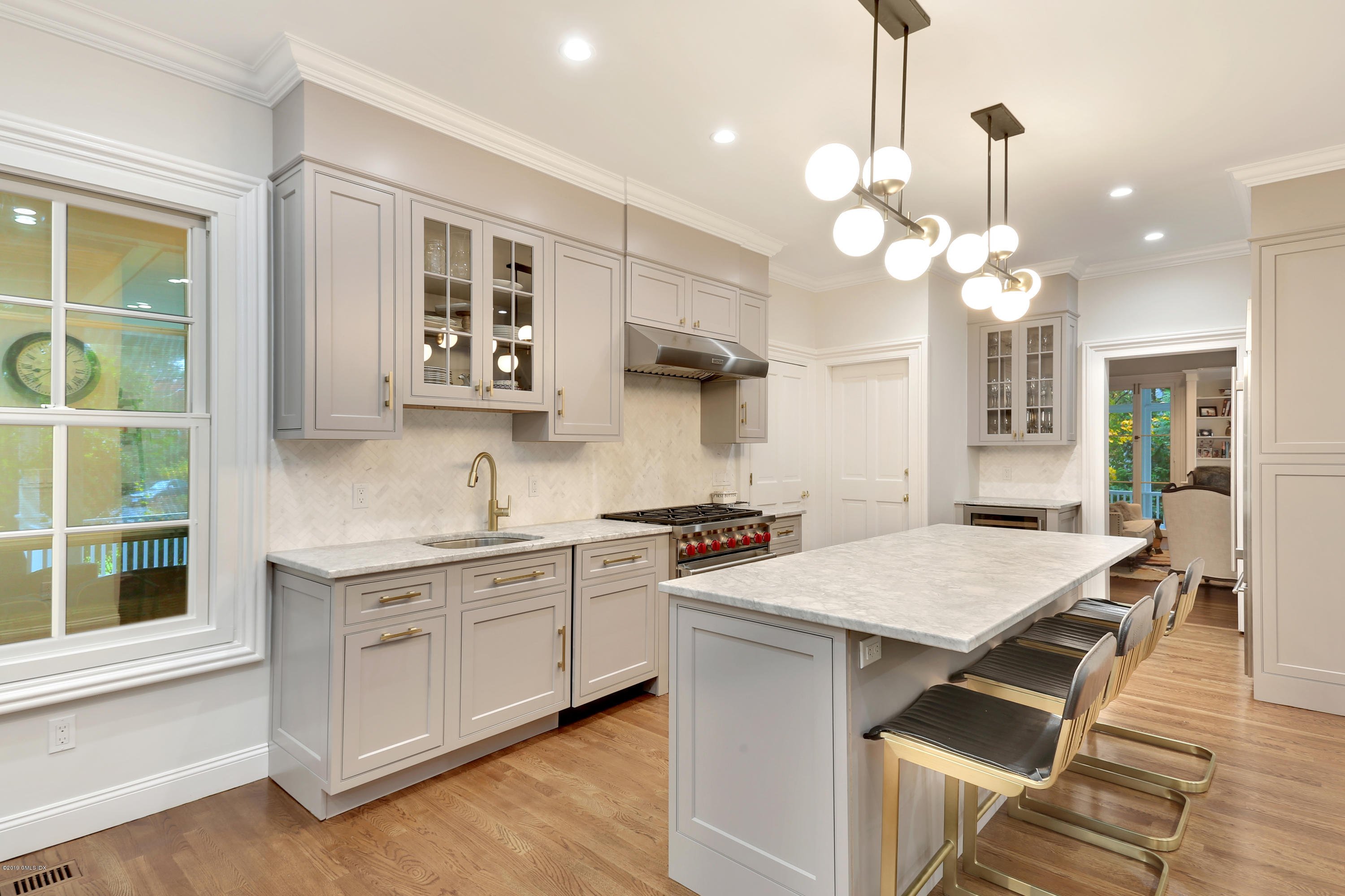 20 Lockwood Road Riverside, CT 06878 - Photo 8 of 27 a kitchen that has a lot of cabinets in it and wooden floors