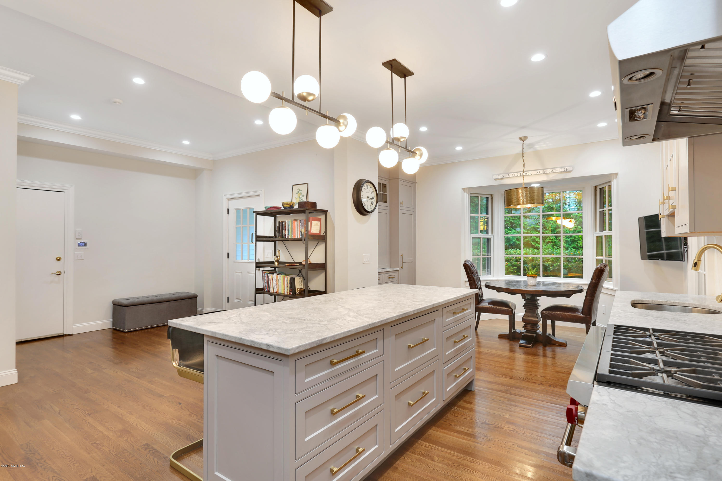 20 Lockwood Road Riverside, CT 06878 - Photo 9 of 27 a living room with kitchen island furniture and a chandelier