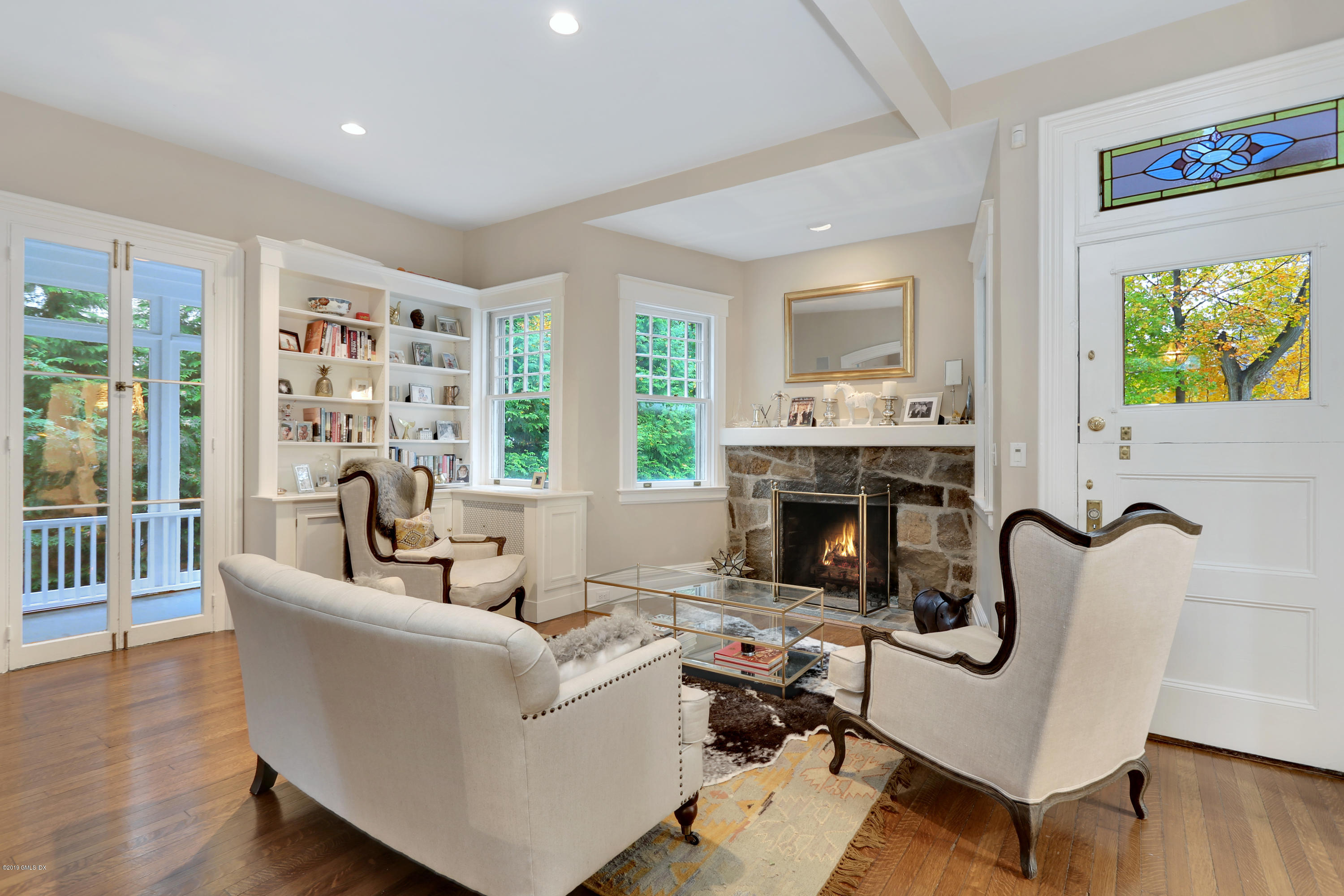 20 Lockwood Road Riverside, CT 06878 - Photo 10 of 27 a living room with furniture and a fireplace