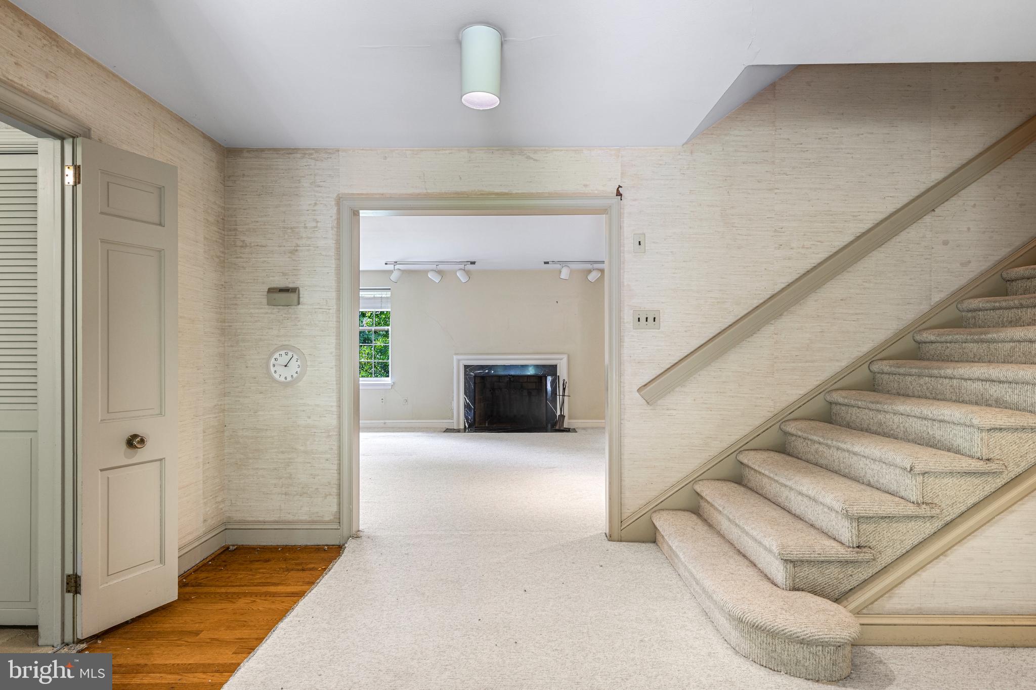 55 Wellesley Road Swarthmore, PA 19081 - Photo 4 of 37 Foyer with open Staircase - hardwood under carpet