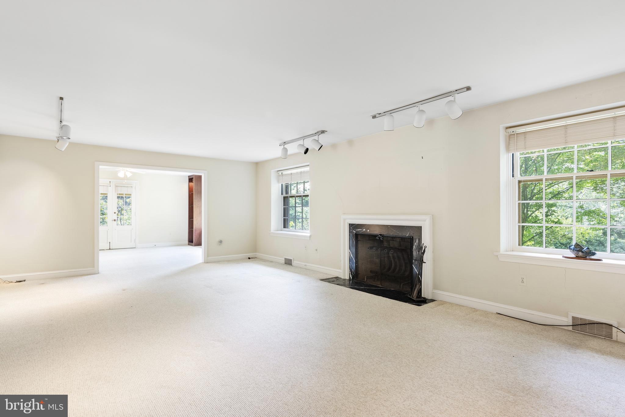 55 Wellesley Road Swarthmore, PA 19081 - Photo 6 of 37 Living Room with FP into Dining Room