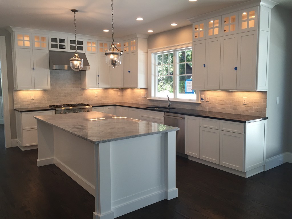 5 Thomas Road Wellesley, MA 02482 - Photo 11 of 29 a kitchen with kitchen island a sink stainless steel appliances and cabinets