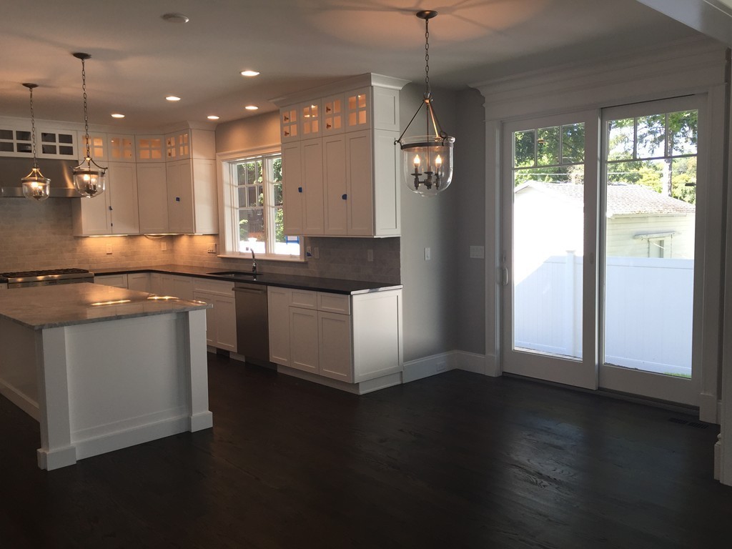 5 Thomas Road Wellesley, MA 02482 - Photo 12 of 29 a kitchen with granite countertop a sink and a stove top oven