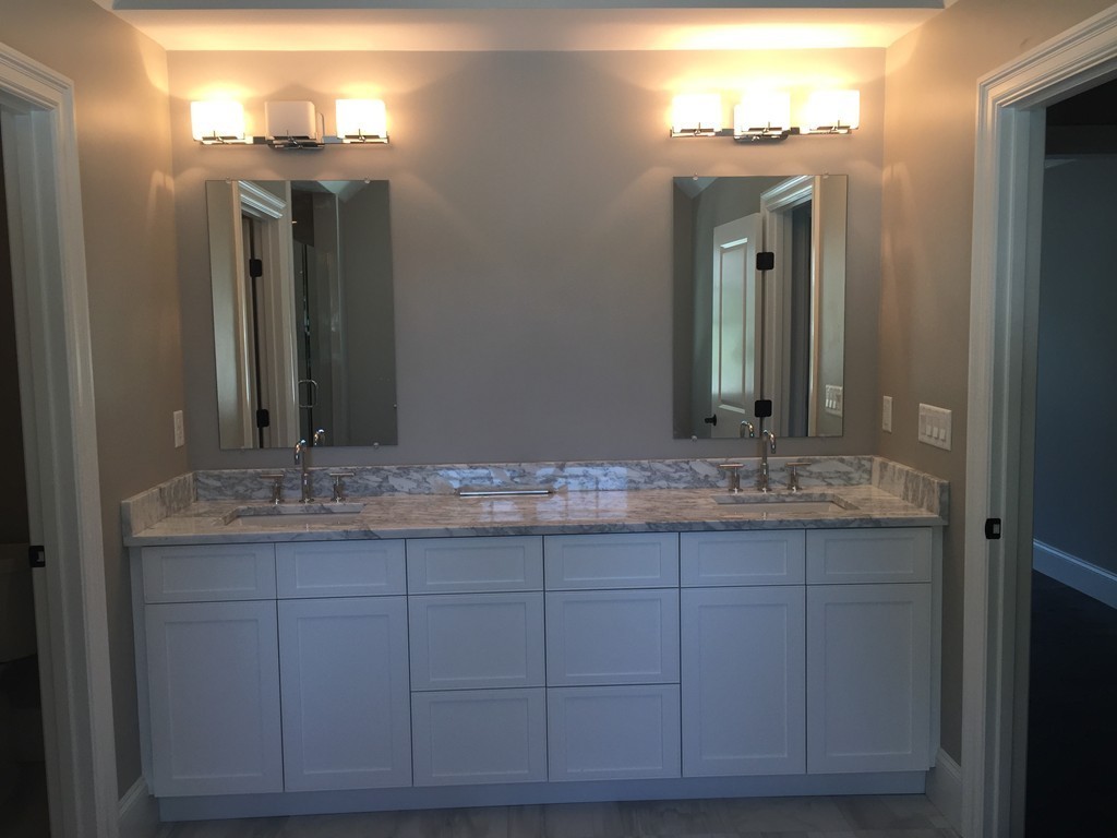 5 Thomas Road Wellesley, MA 02482 - Photo 18 of 29 a bathroom with a granite countertop sink and a mirror