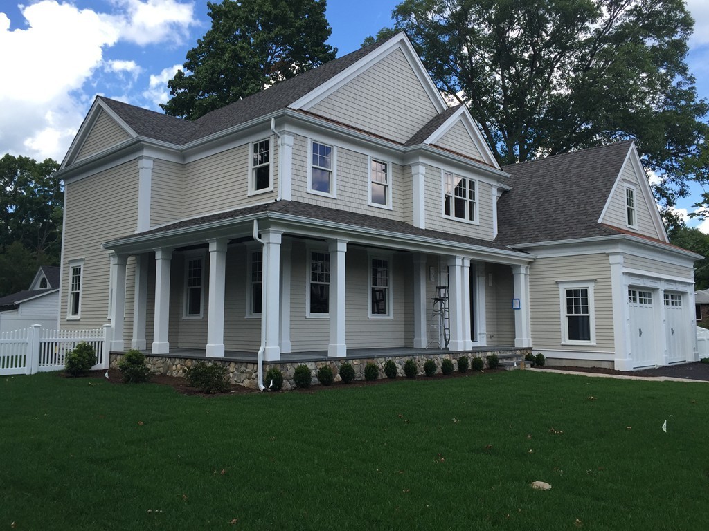 5 Thomas Road Wellesley, MA 02482 - Photo 2 of 29 a front view of a house with a garden