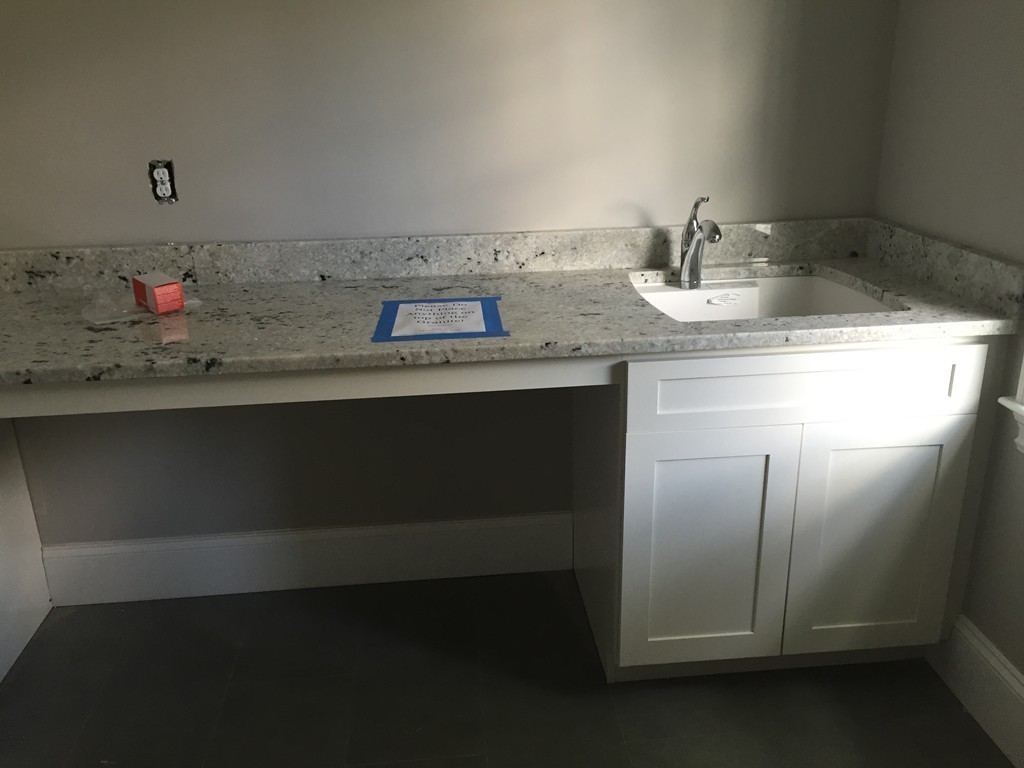 5 Thomas Road Wellesley, MA 02482 - Photo 23 of 29 a bathroom with a sink and a mirror