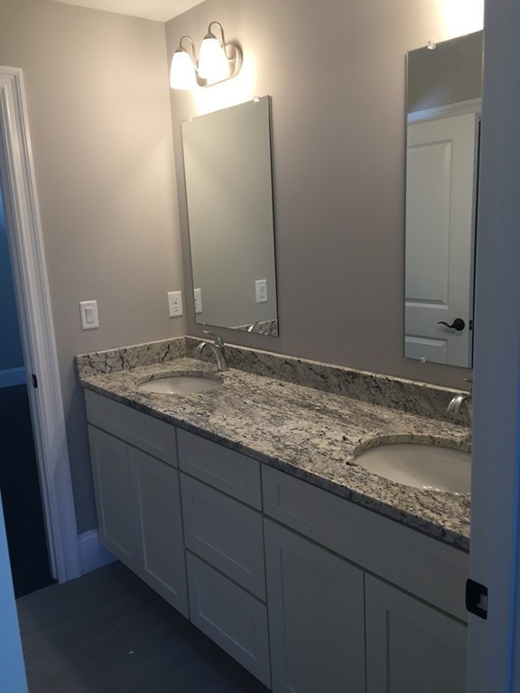 5 Thomas Road Wellesley, MA 02482 - Photo 24 of 29 a bathroom with a granite countertop sink and a mirror