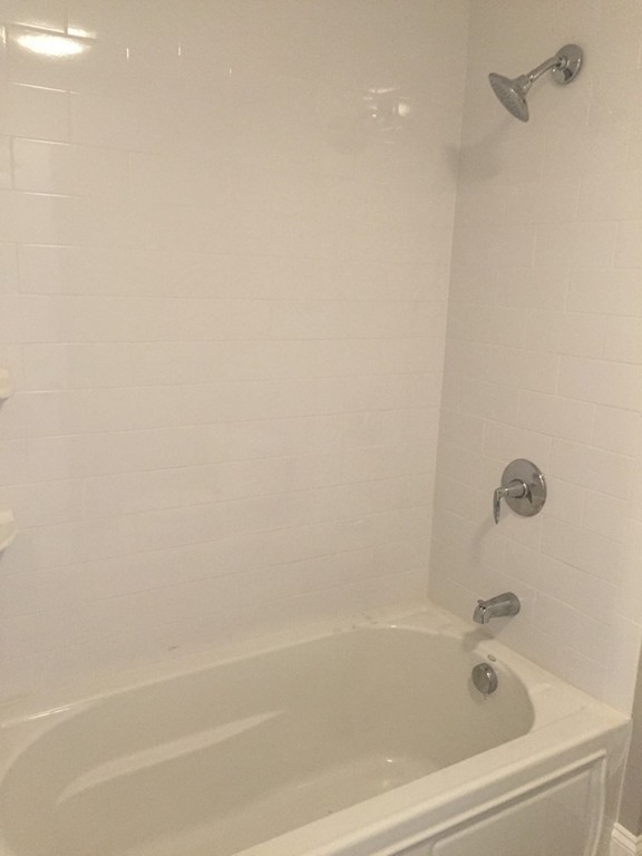 5 Thomas Road Wellesley, MA 02482 - Photo 25 of 29 a close view of a bathtub in bathroom