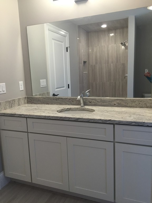 5 Thomas Road Wellesley, MA 02482 - Photo 26 of 29 a bathroom with a granite countertop sink and a mirror