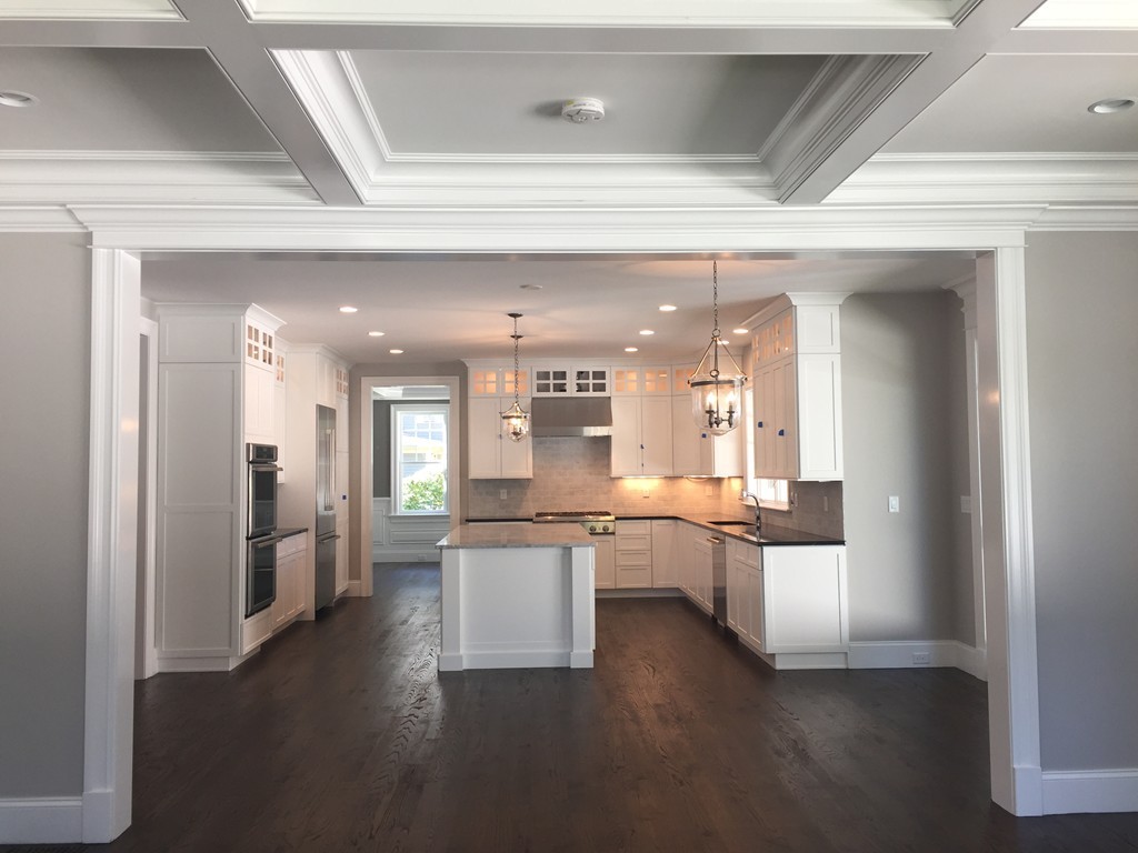 5 Thomas Road Wellesley, MA 02482 - Photo 7 of 29 a large white kitchen with lots of counter top space and stainless steel appliances