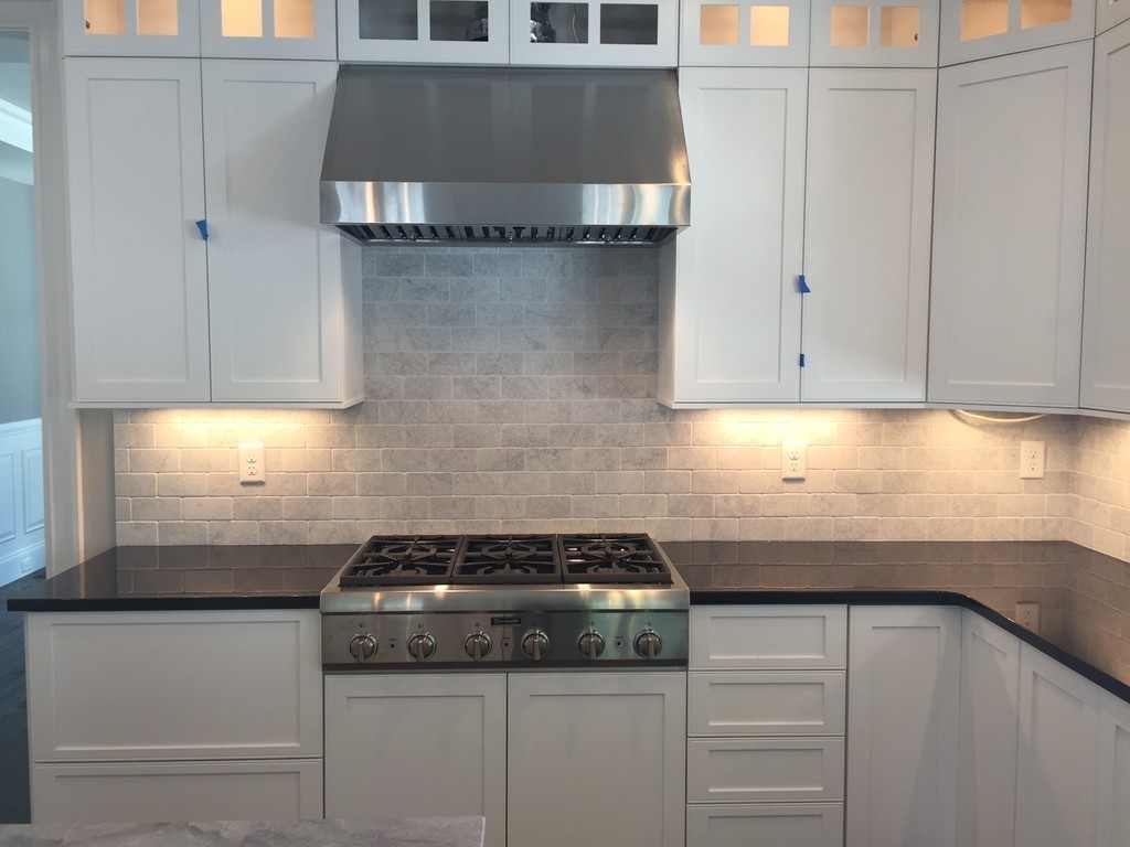 5 Thomas Road Wellesley, MA 02482 - Photo 9 of 29 a kitchen with granite countertop white cabinets and a stove