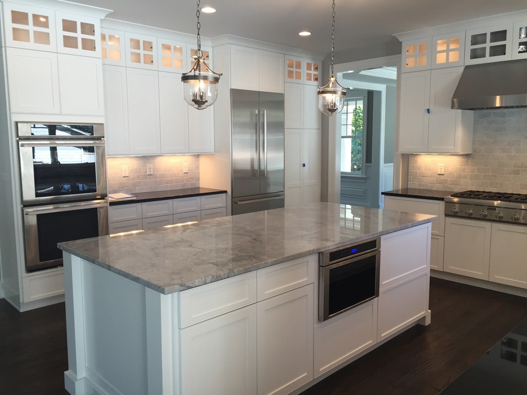 5 Thomas Road Wellesley, MA 02482 - Photo 10 of 29 a kitchen with stainless steel appliances granite countertop a sink and a stove