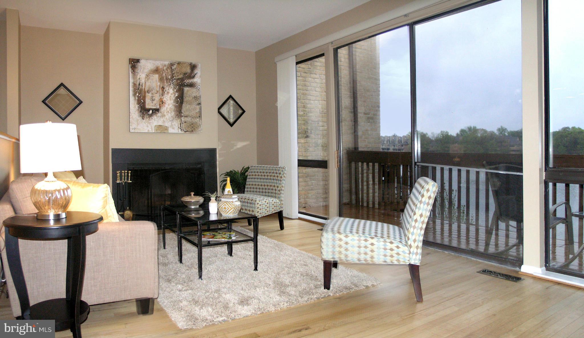 11204 Lagoon Lane Reston, VA 20191 - Photo 12 of 30 a living room with furniture and a fireplace