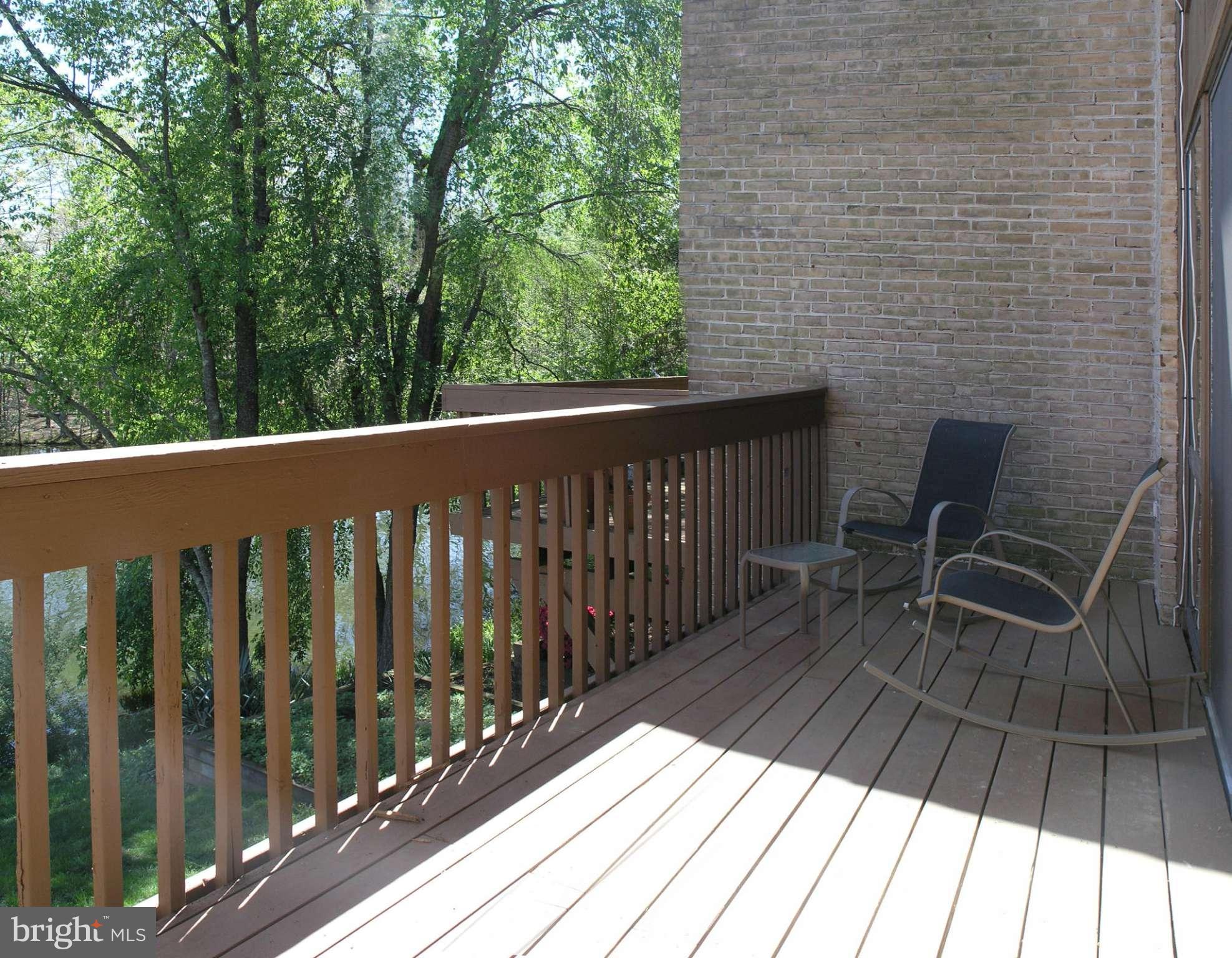 11204 Lagoon Lane Reston, VA 20191 - Photo 13 of 30 a balcony with wooden floor and outdoor space