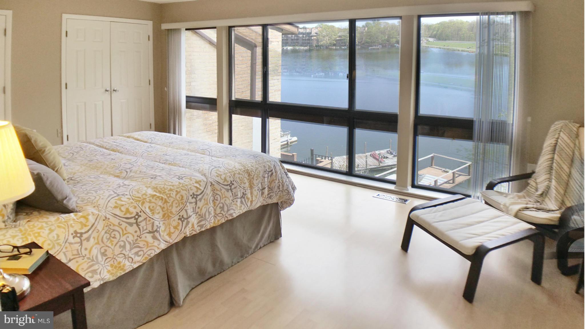 11204 Lagoon Lane Reston, VA 20191 - Photo 15 of 30 a bedroom with a bed and window