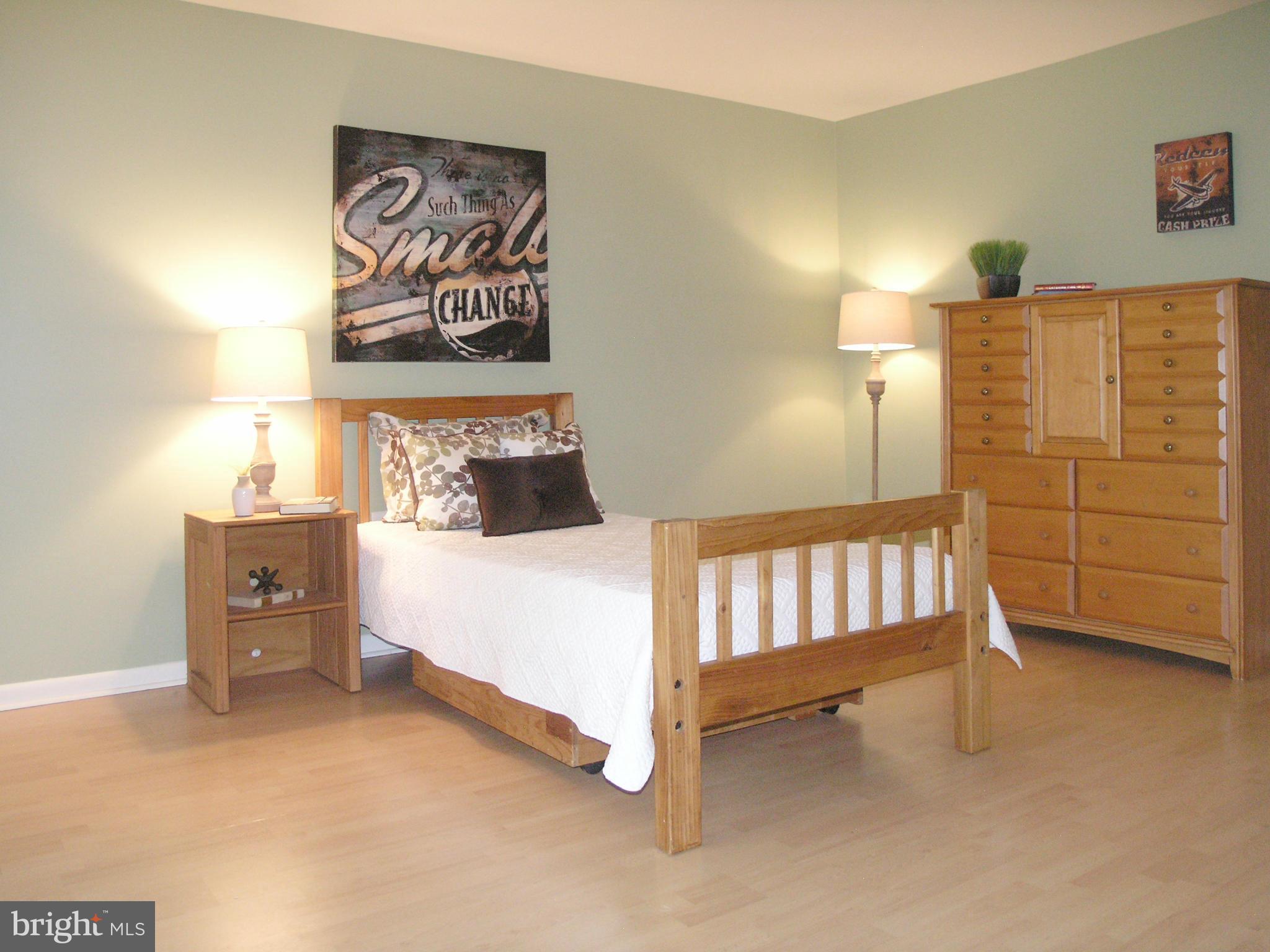 11204 Lagoon Lane Reston, VA 20191 - Photo 18 of 30 a bedroom with a bed and a window