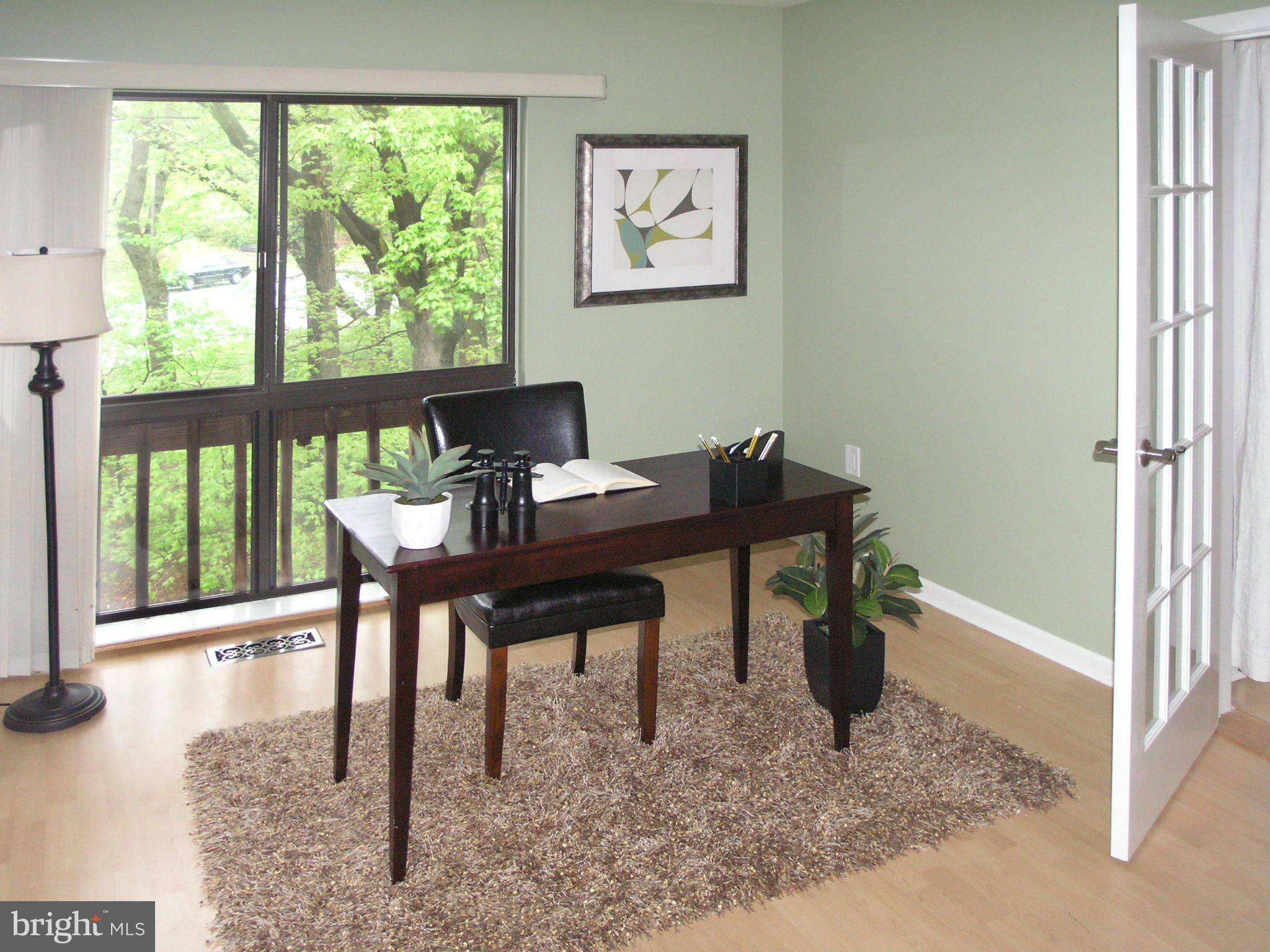 11204 Lagoon Lane Reston, VA 20191 - Photo 20 of 30 a view of a workspace with furniture and a window