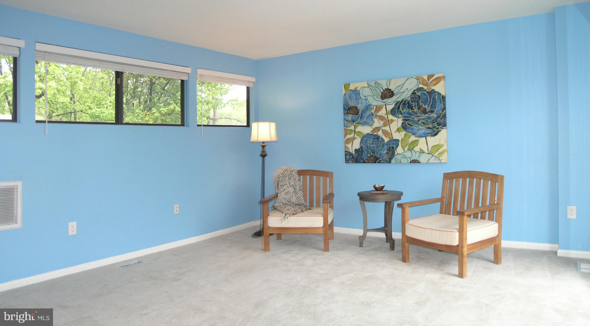 11204 Lagoon Lane Reston, VA 20191 - Photo 23 of 30 a living room with furniture and a window