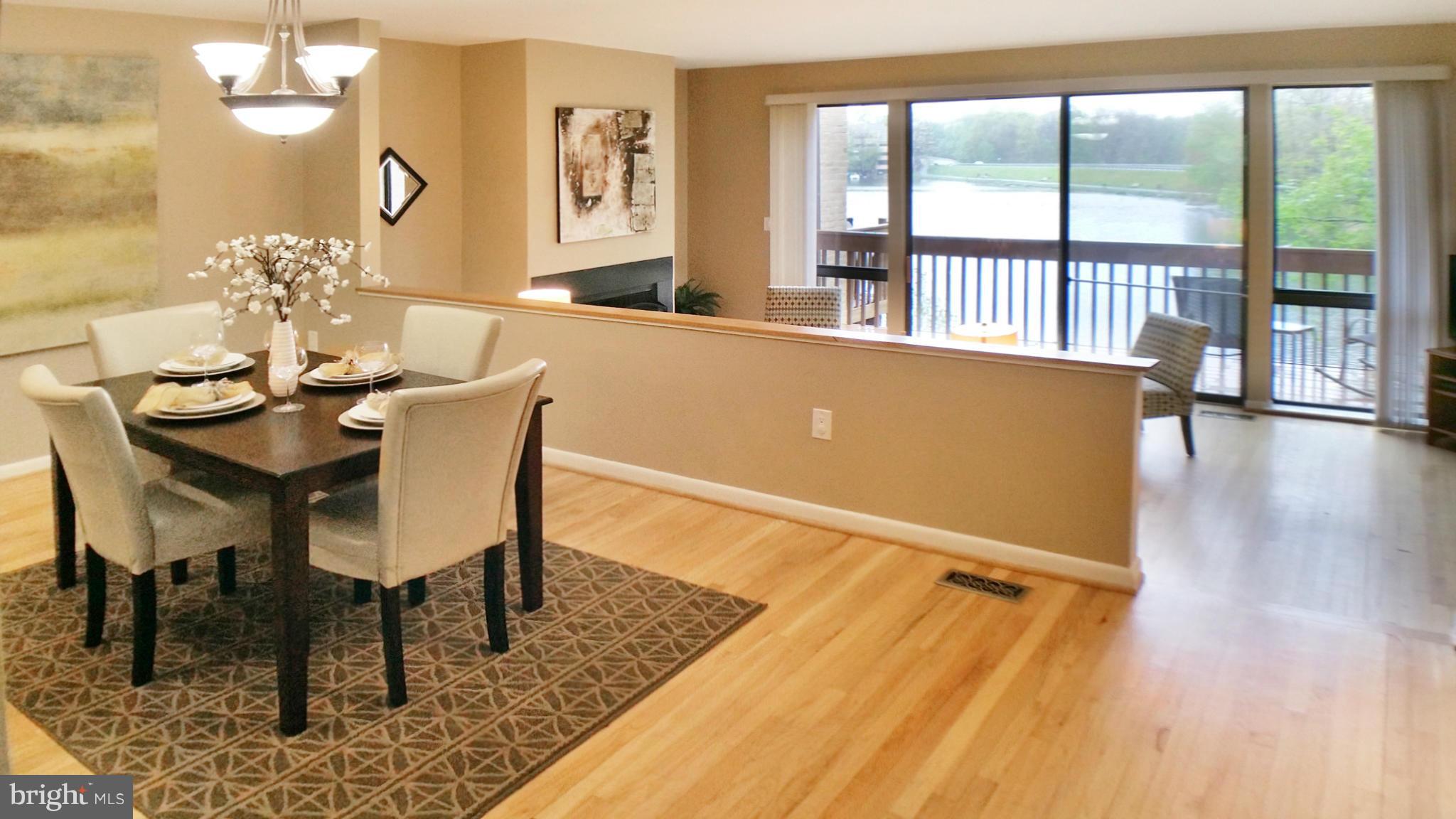 11204 Lagoon Lane Reston, VA 20191 - Photo 8 of 30 a view of a dining room with furniture window and wooden floor