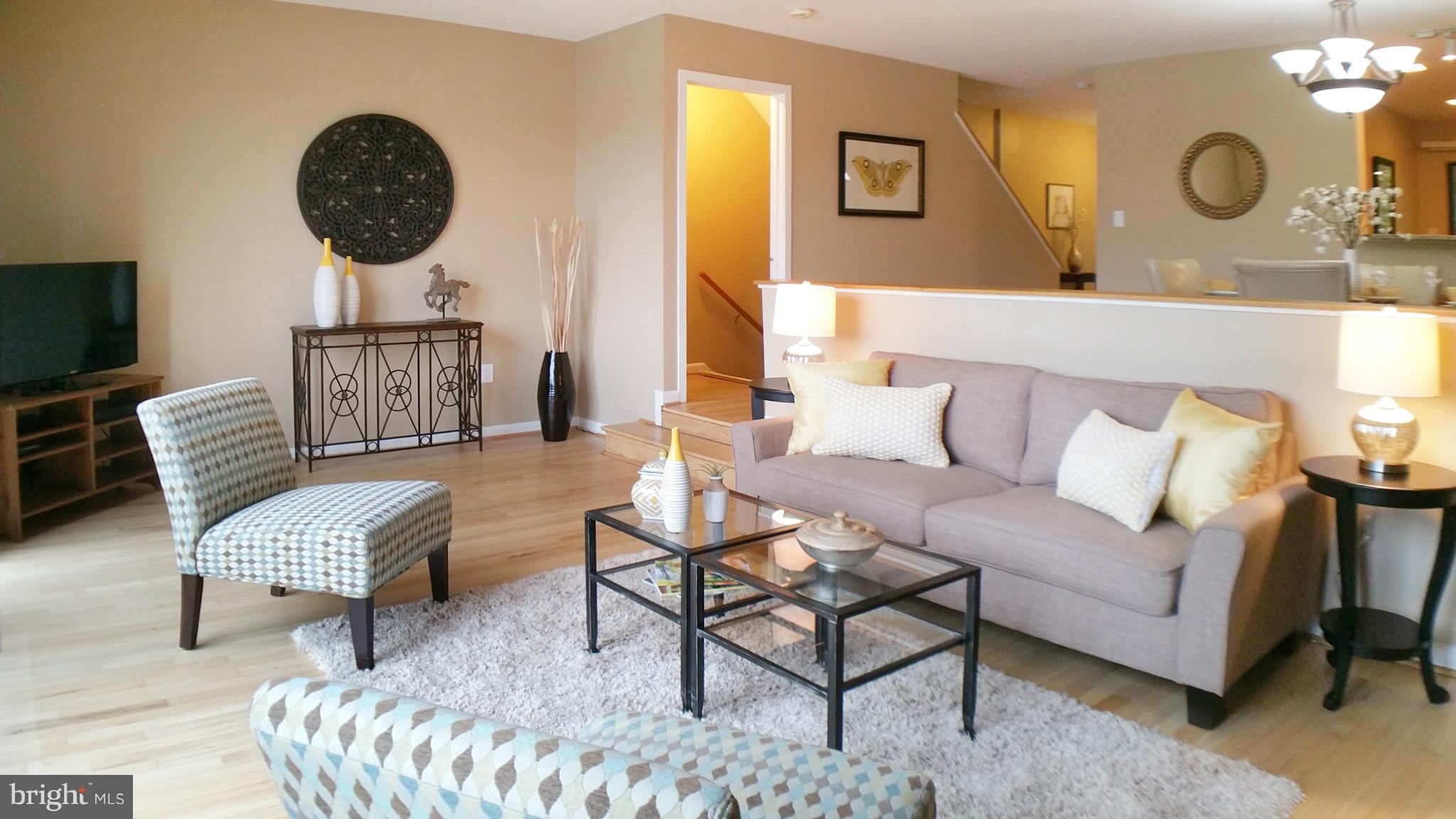 11204 Lagoon Lane Reston, VA 20191 - Photo 10 of 30 a living room with furniture and a mirror