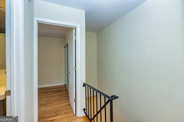 a view of a hallway with washer and dryer