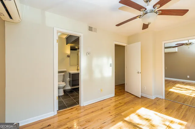 a room with a wooden floor and a window