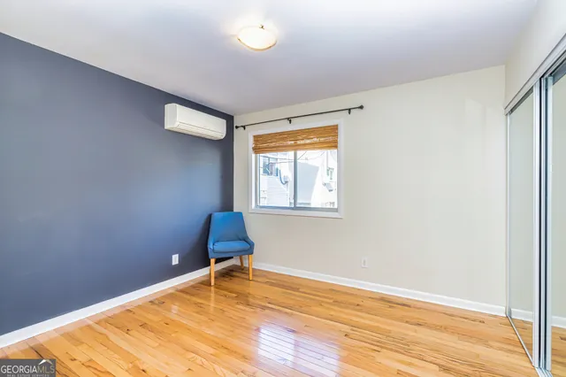 a view of room with window and a chair