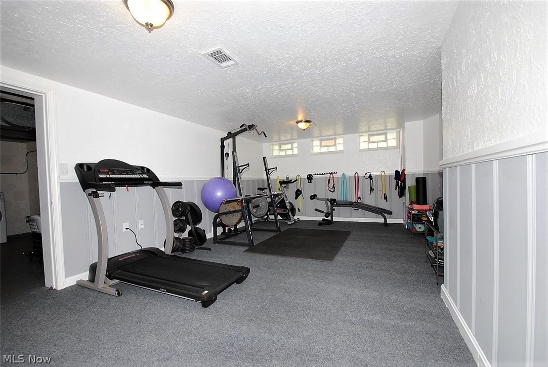 3634 Lynnfield Road Shaker Heights, OH 44122 - Photo 20 of 24 FINISHED BASEMENT REC ROOM HAS CARPETING AND BEAD BOARD PANELING