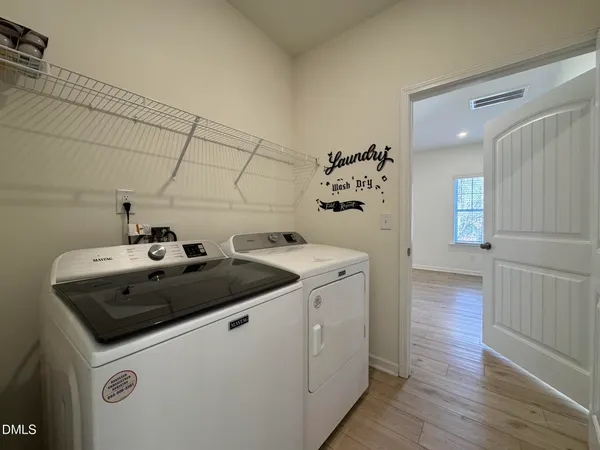 a utility room with washer and dryer