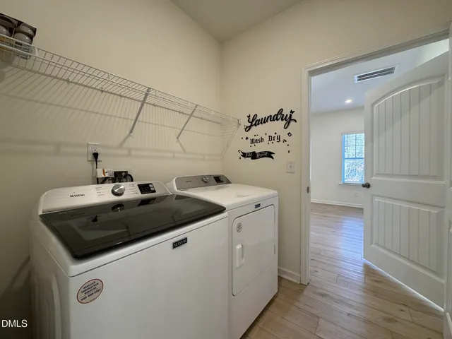 a utility room with washer and dryer