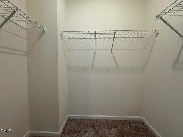 a view of a room with racks on the wall