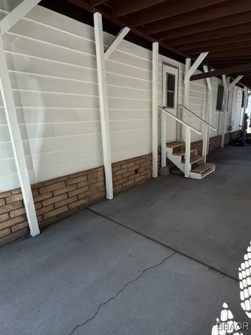 a view of a chairs and table in the wooden house