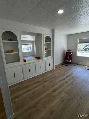 a view of a livingroom with wooden floor