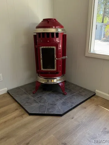 a room with fireplace and a wooden floor