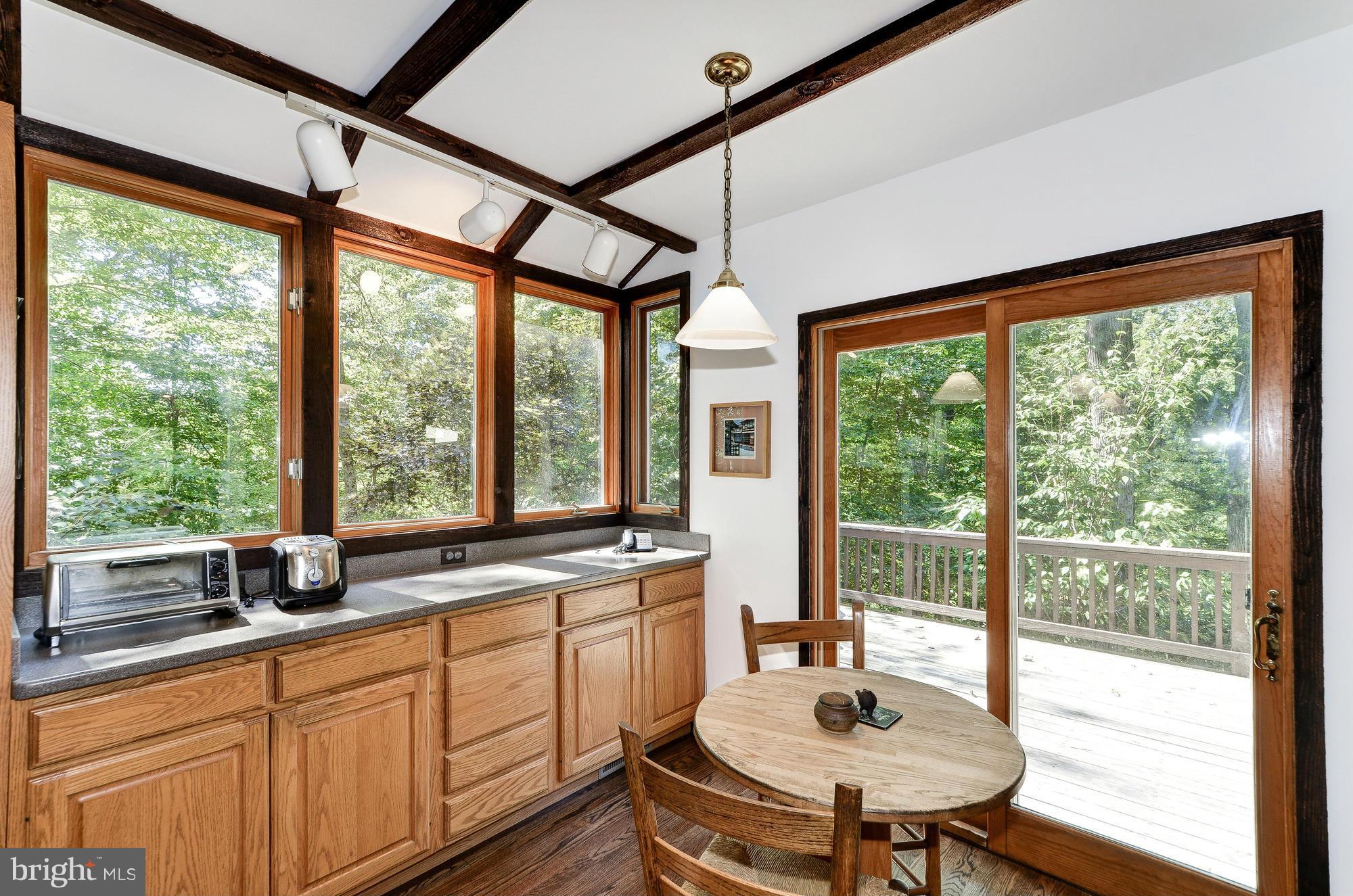 11500 Glen Road Potomac, MD 20854 - Photo 7 of 30 Table space area with doors to rear deck