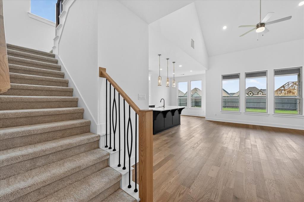 3776 Jane Street Venus, TX 76084 - Photo 21 of 25 a view of a room with wooden floor and stairs