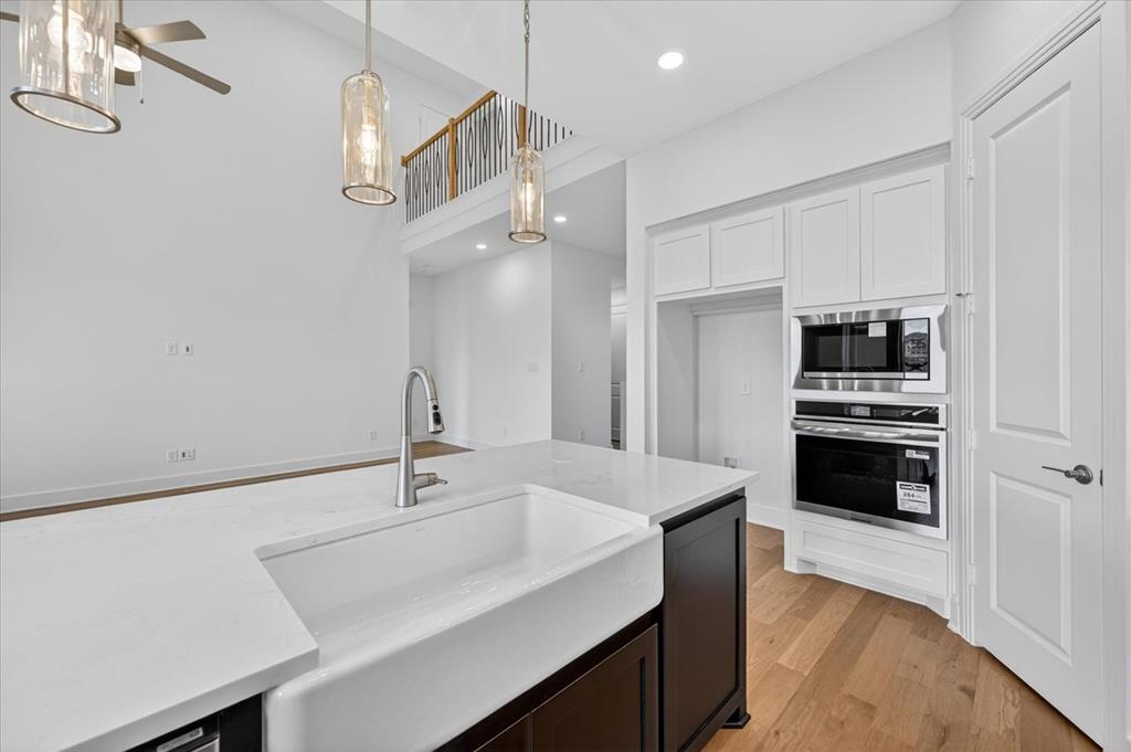 3776 Jane Street Venus, TX 76084 - Photo 4 of 25 a kitchen with a sink stainless steel appliances and cabinets