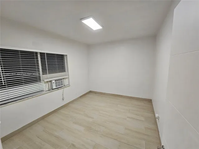 a view of a room with a window