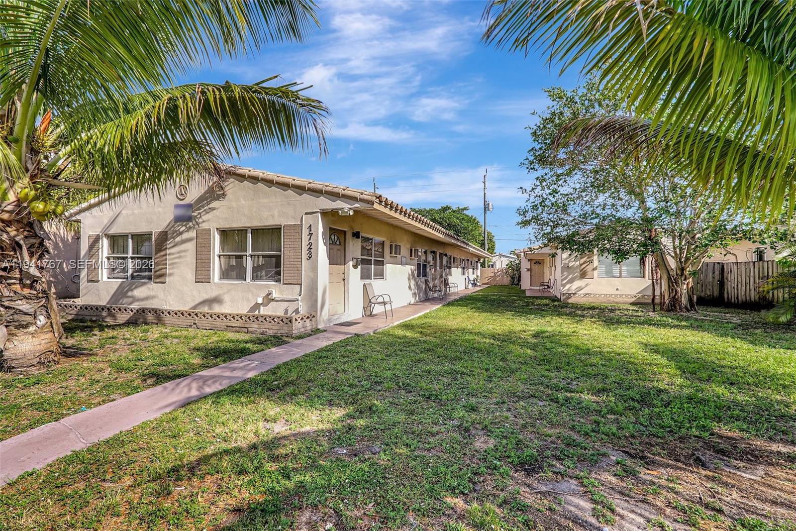1723 Liberty Street, Unit 4 Hollywood, FL 33020 - Photo 2 of 13 a view of a house with a yard