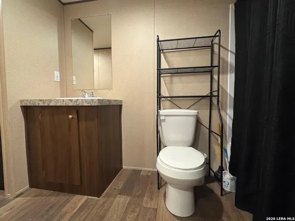 a bathroom with a toilet and a sink