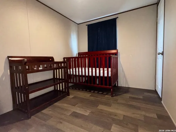 a view of a porch with wooden floor