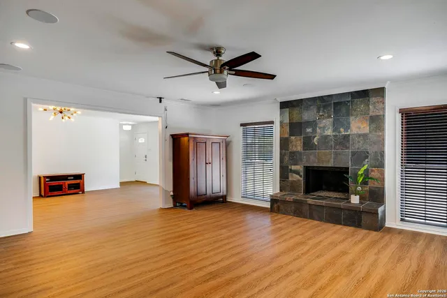 a view of a livingroom with a fireplace and window