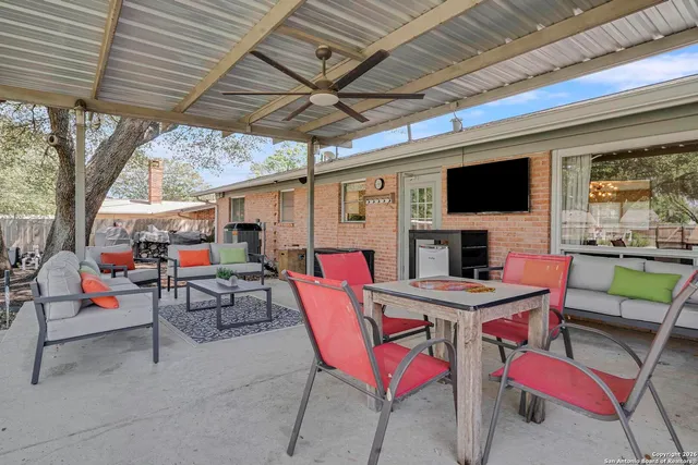a outdoor space with patio furniture and a fireplace