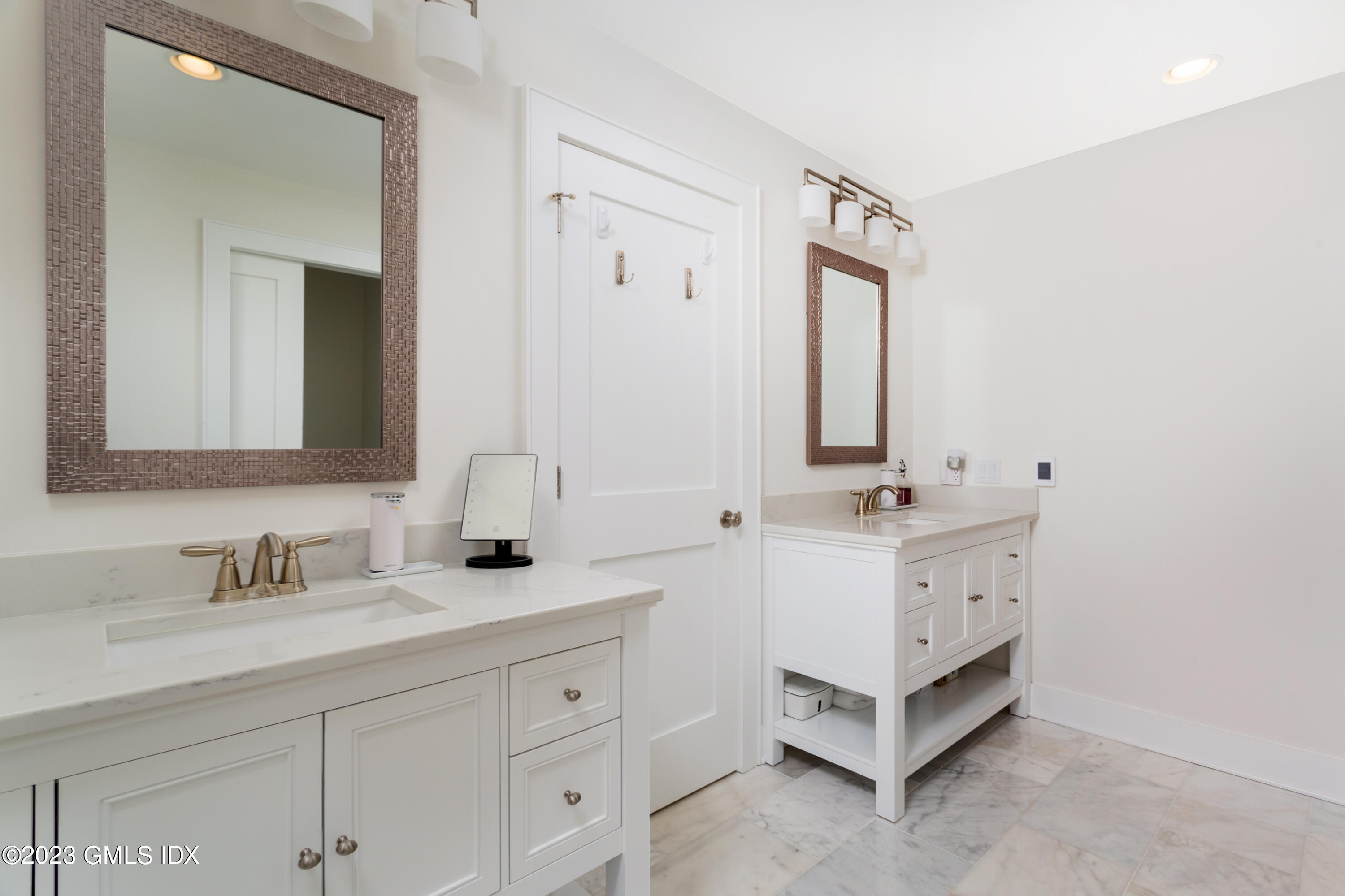 9 Cottontail Road Cos Cob, CT 06807 - Photo 11 of 33 a bathroom with a double vanity sink mirror and