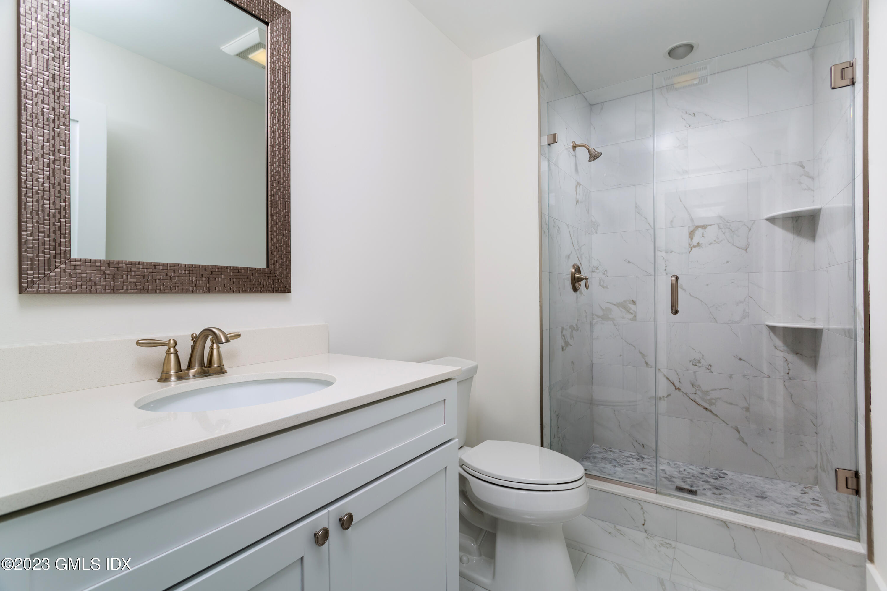 9 Cottontail Road Cos Cob, CT 06807 - Photo 14 of 33 a bathroom with a sink a toilet and shower