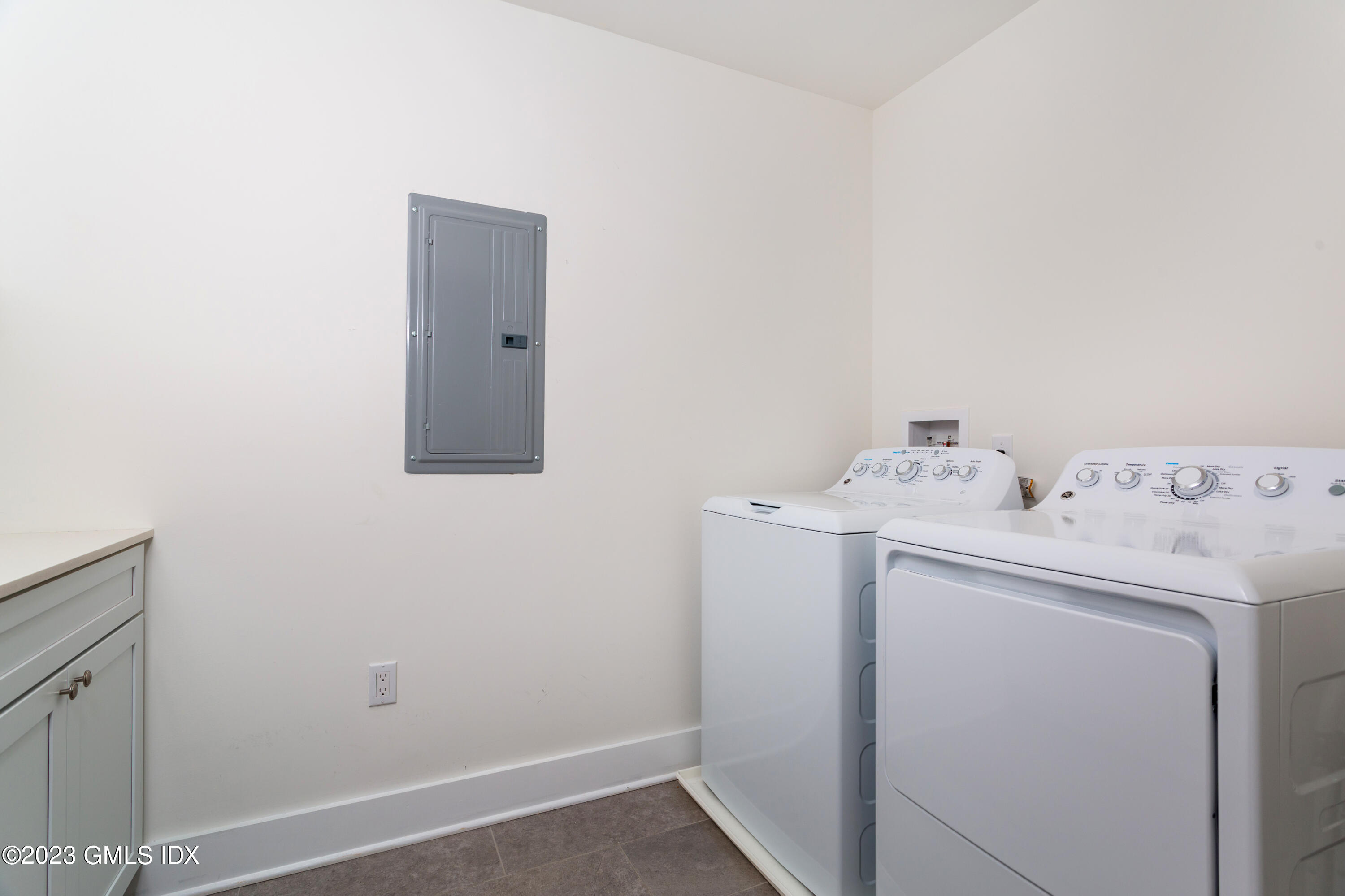 9 Cottontail Road Cos Cob, CT 06807 - Photo 16 of 33 a utility room with dryer and washer
