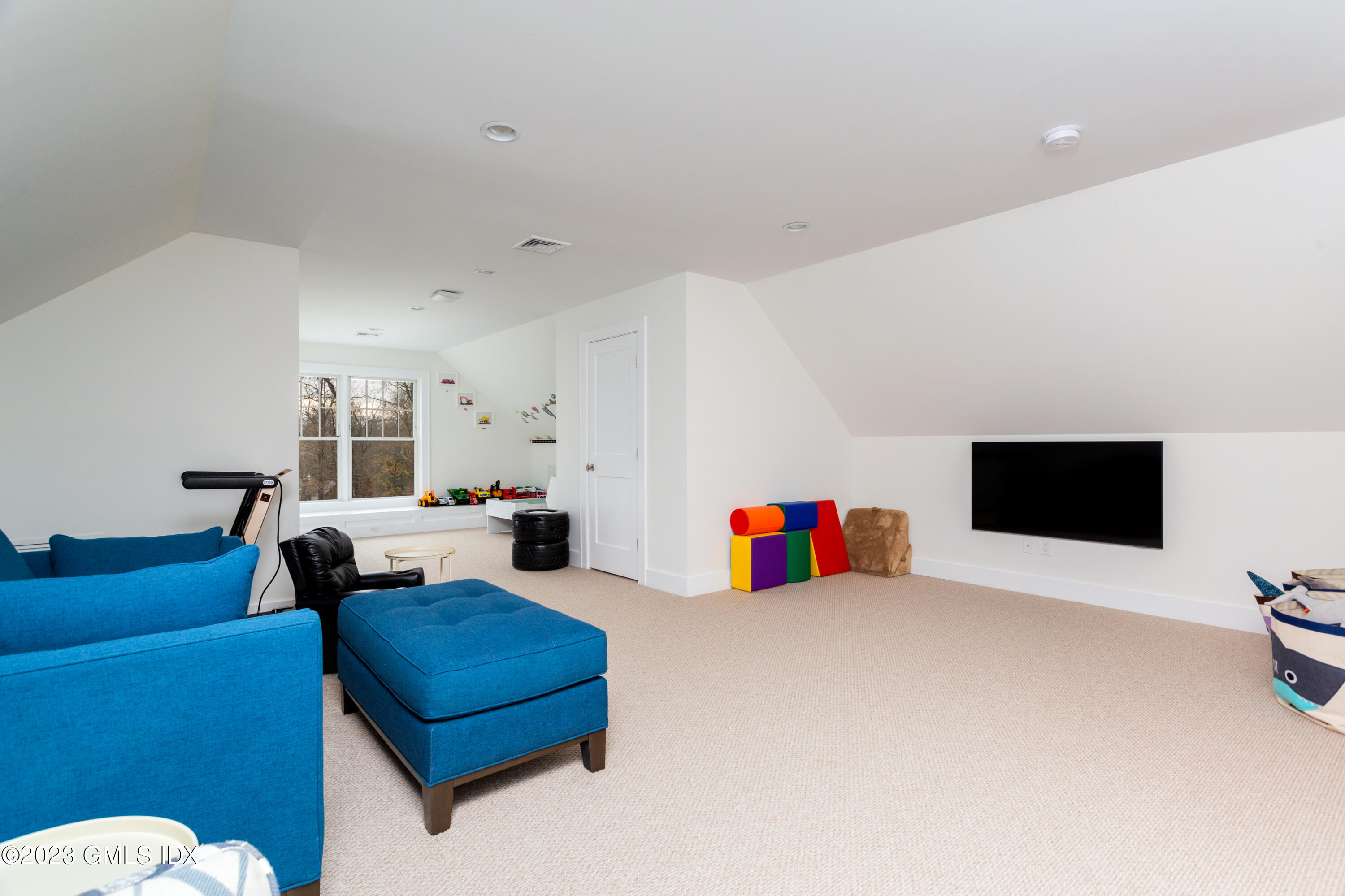 9 Cottontail Road Cos Cob, CT 06807 - Photo 18 of 33 a bedroom with furniture and a flat screen tv