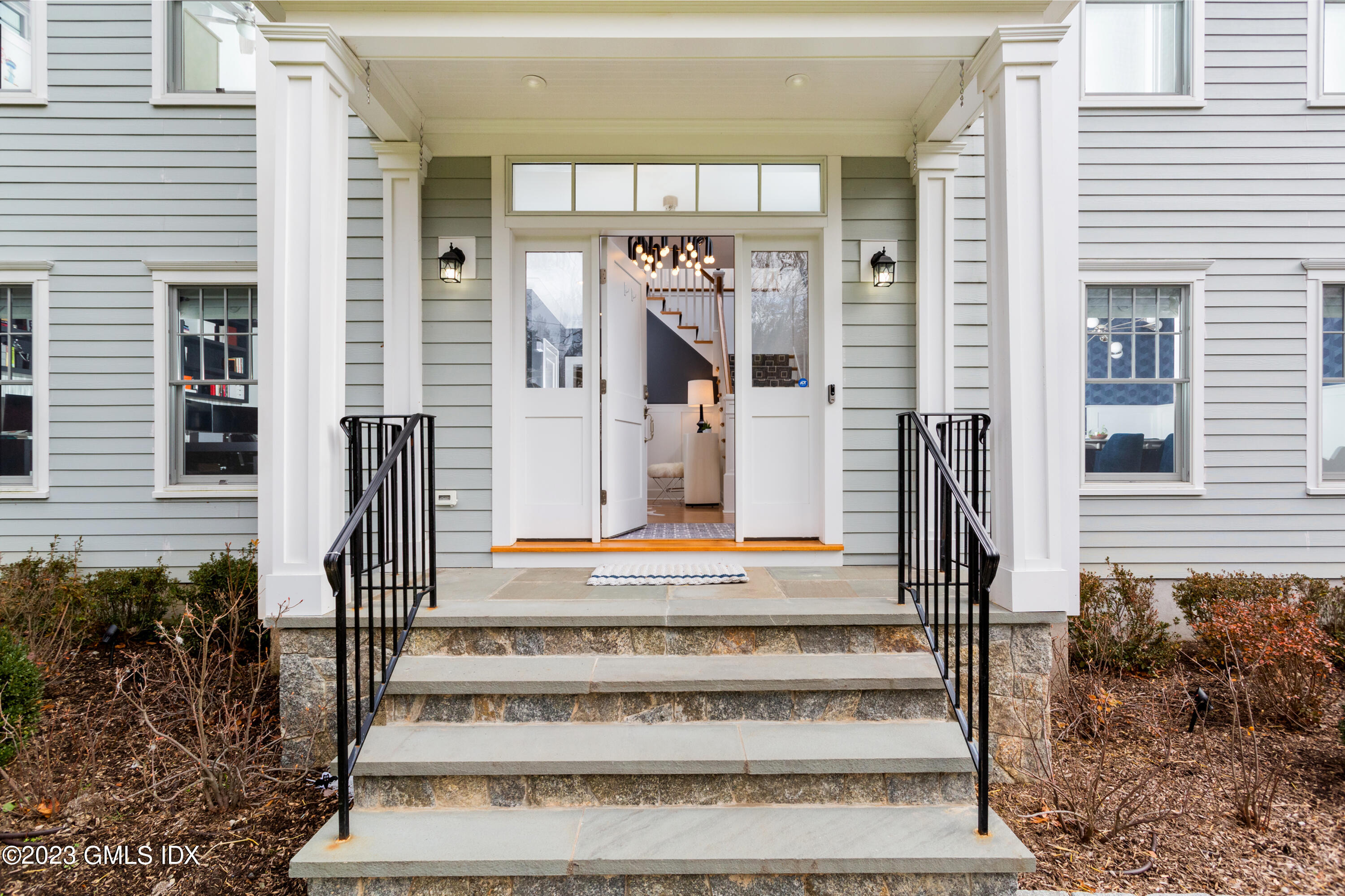 9 Cottontail Road Cos Cob, CT 06807 - Photo 2 of 33 a front view of a building with a garden and plants
