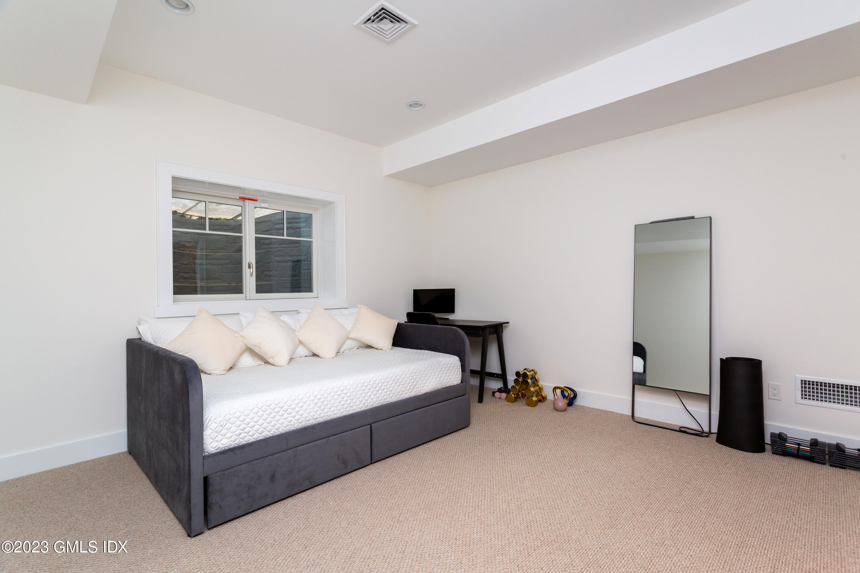 9 Cottontail Road Cos Cob, CT 06807 - Photo 22 of 33 a bedroom with a bed and a window