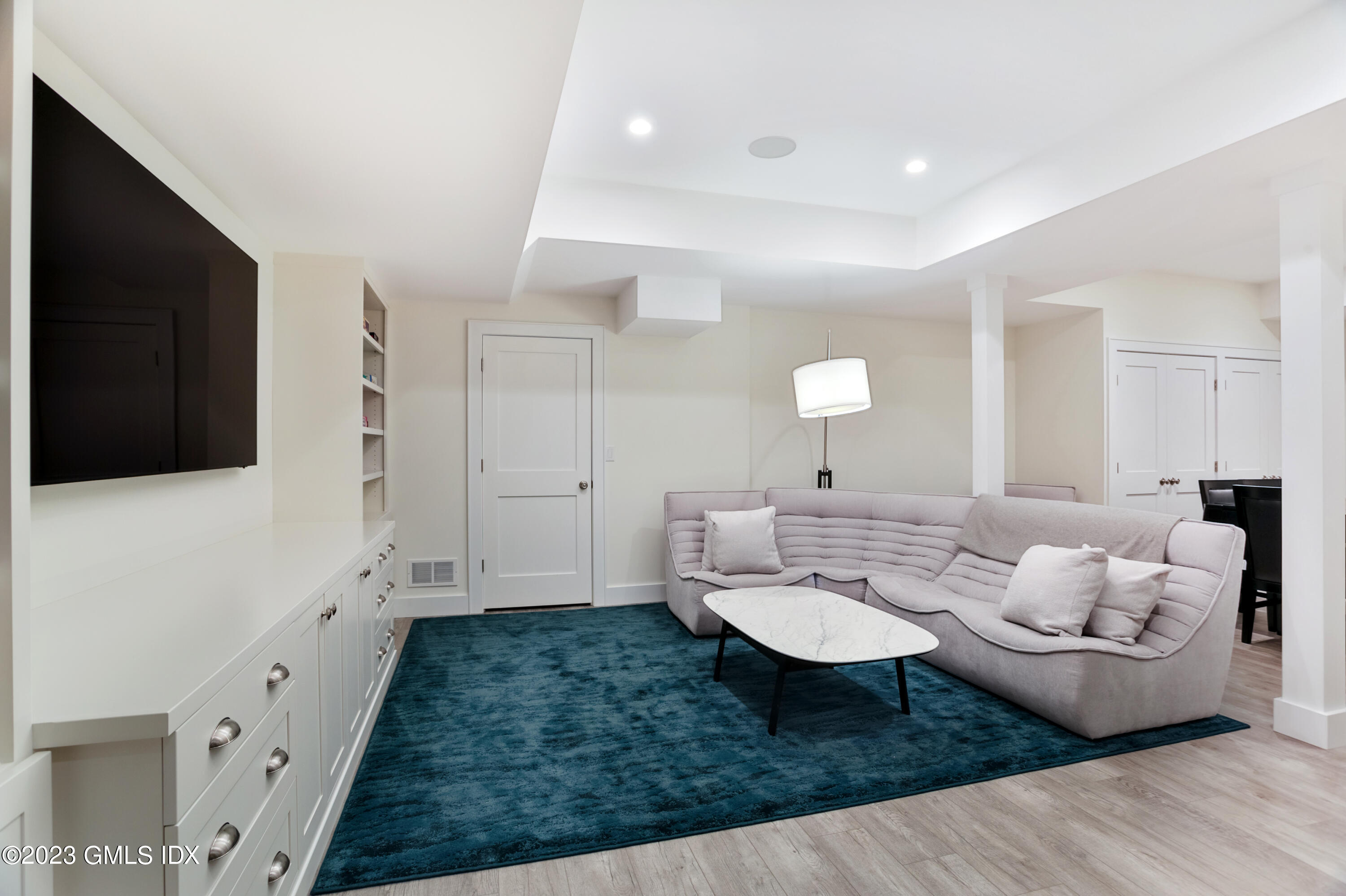 9 Cottontail Road Cos Cob, CT 06807 - Photo 23 of 33 a living room with furniture and a flat screen tv